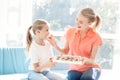 The girl prepared a surprise for her mother. Daughter gave mother a box of chocolates. Royalty Free Stock Photo