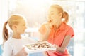 The girl prepared a surprise for her mother. Daughter gave mother a box of chocolates. Royalty Free Stock Photo