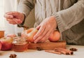 The girl prepares baked apples with honey. Healthy food