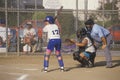 Girl preparing at bat with umpire, Girls Softball game, Brentwood, CA