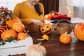 Girl preparing for halloween by pulling the insides of pumpkin Royalty Free Stock Photo