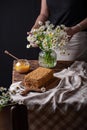 girl preparing honey cake on the table