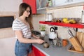 Girl preparing moka pot cofee in the kitchen Royalty Free Stock Photo