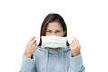 Girl wearing blue winter coat and preparing to wear mask againt flu and covid-19,corona virus Royalty Free Stock Photo
