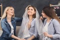 Girl preparing for wedding and showing bridal veil