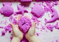 Kid`s hands with kinesthetic sand Royalty Free Stock Photo