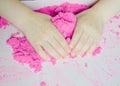 Kid`s hands with kinesthetic sand Royalty Free Stock Photo