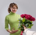 Girl presented with a bouquet of flowers Royalty Free Stock Photo