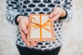 The girl presents a gift Christmas envelope