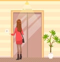 Girl presses elevator call button. Female passengers standing next to door of lift in hotel Royalty Free Stock Photo