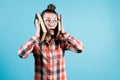 The girl presses two large books to her head and looks away with apprehension Royalty Free Stock Photo