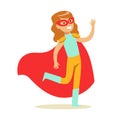 Girl Pretending To Have Super Powers Dressed In Blue And Yellow Superhero Costume With Red Cape And Mask Smiling Royalty Free Stock Photo