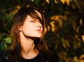 Girl with pretty hair enjoys sunny fall time