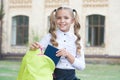 Girl primary school pupil happy going to school, doing homework concept