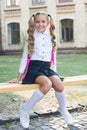 Girl primary school pupil happy going to school, formal education concept