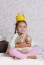 Girl in princess crown at pyjamas party