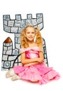 Girl in princess dress and her cardboard castle Royalty Free Stock Photo