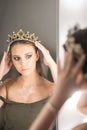 Girl princess and reflection in mirror. Woman wear jewelry crown at mirror. Beauty queen with glamour look in dressing Royalty Free Stock Photo