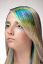 Girl with professional hair colouring and creative make up in peacock style Royalty Free Stock Photo