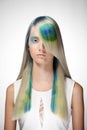 Girl with professional hair colouring and creative make up in peacock style Royalty Free Stock Photo