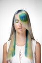 Girl with professional hair colouring and creative make up in peacock style Royalty Free Stock Photo