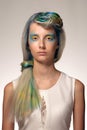 Girl with professional hair colouring and creative make up in peacock style Royalty Free Stock Photo