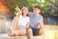 Girl prompts the boy, pointing with his hand at something Royalty Free Stock Photo