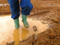 Girl in a puddle of mud