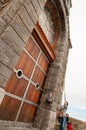 Girl pull the rope of the church bell Royalty Free Stock Photo