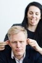 Girl pulling boyfriend`s ears to make a fun - true love