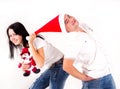 Girl pulls Santa cap over. Holidays