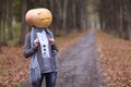 Girl with pumpkin head Royalty Free Stock Photo