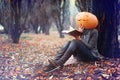 Girl with pumpkin head Royalty Free Stock Photo