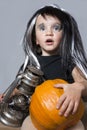 Girl with pumpkin and oil lamp