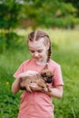 A girl with a puppy in her arms - best friend and companion, animal care Royalty Free Stock Photo