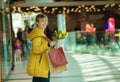 Girl with purchases. Woman with packages from the store.