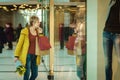 Girl with purchases. Woman with packages from the store.