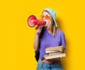 Girl in purple clothes with pink megaphone and books