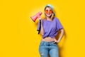 Girl in purple clothes with pink megaphone