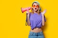 Girl in purple clothes with pink megaphone