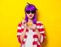 Girl with purple hair holding lemonade cocktail Royalty Free Stock Photo