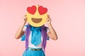 Girl in purple wig holding infatuation emoticon isolated on pink Royalty Free Stock Photo