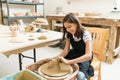 Girl Pursuing Hobby Of Pottery In Class Royalty Free Stock Photo