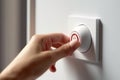 The girl push button power by finger of the air conditioner through the console on the wall in the hotel. Generative AI Royalty Free Stock Photo