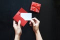 A girl puts in an envelope her Love message