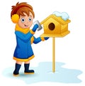 Girl puts a letter into the mailbox in winter