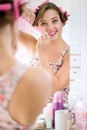 Girl putting curlers in hair Royalty Free Stock Photo