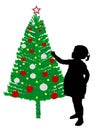 Girl putting decoration on christmas tree