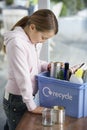 Girl Putting Empty Vessels Into Recycling Container Royalty Free Stock Photo