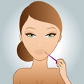 Girl putting on lip-gloss Royalty Free Stock Photo